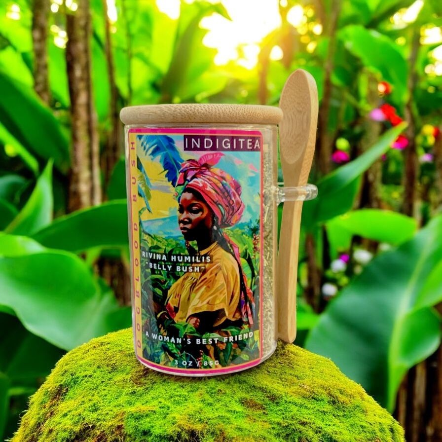 Indigitea container on moss with vibrant artwork, surrounded by lush greenery.