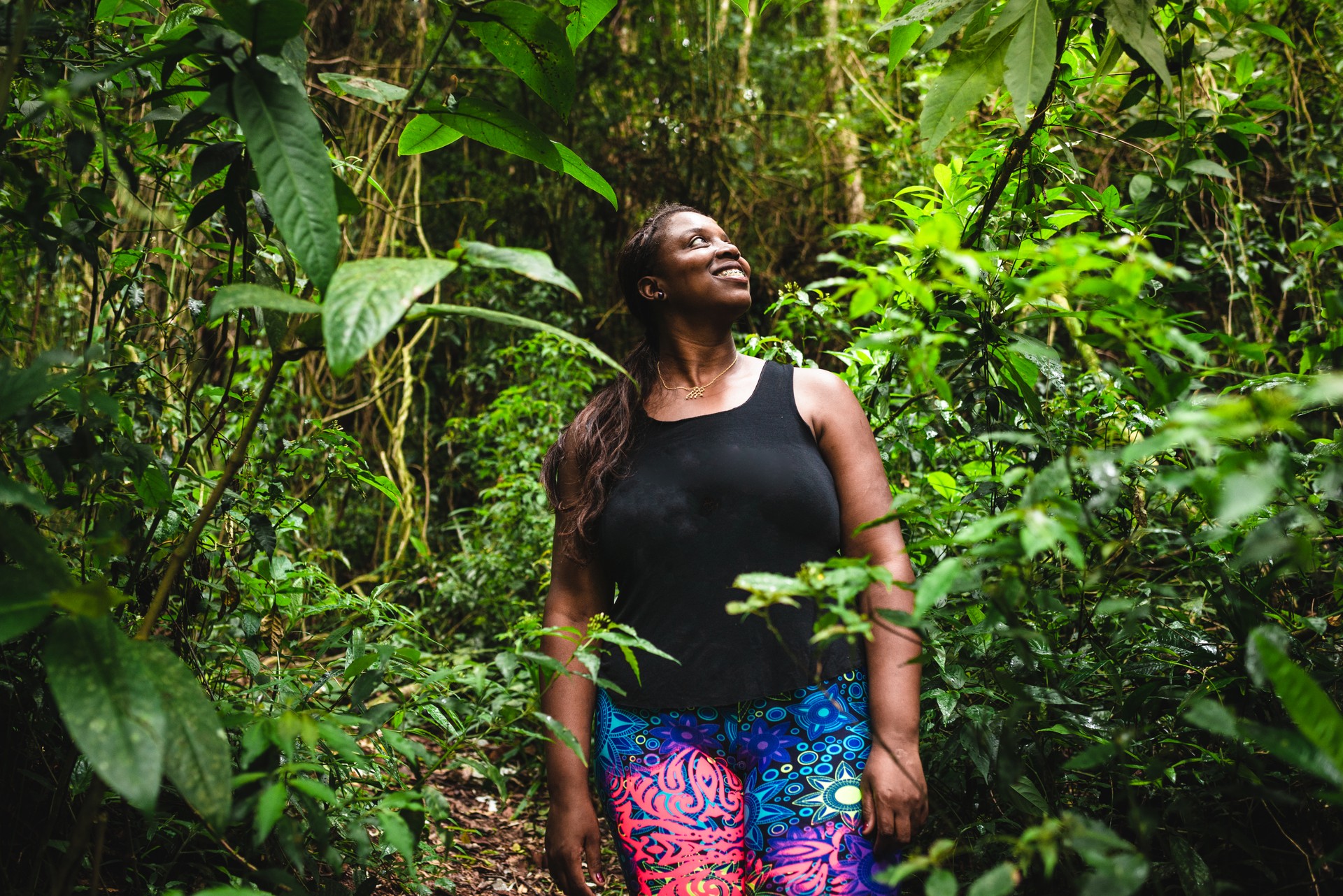 Brazilian woman contemplating nature, forest bathing in jungle, tropical forest