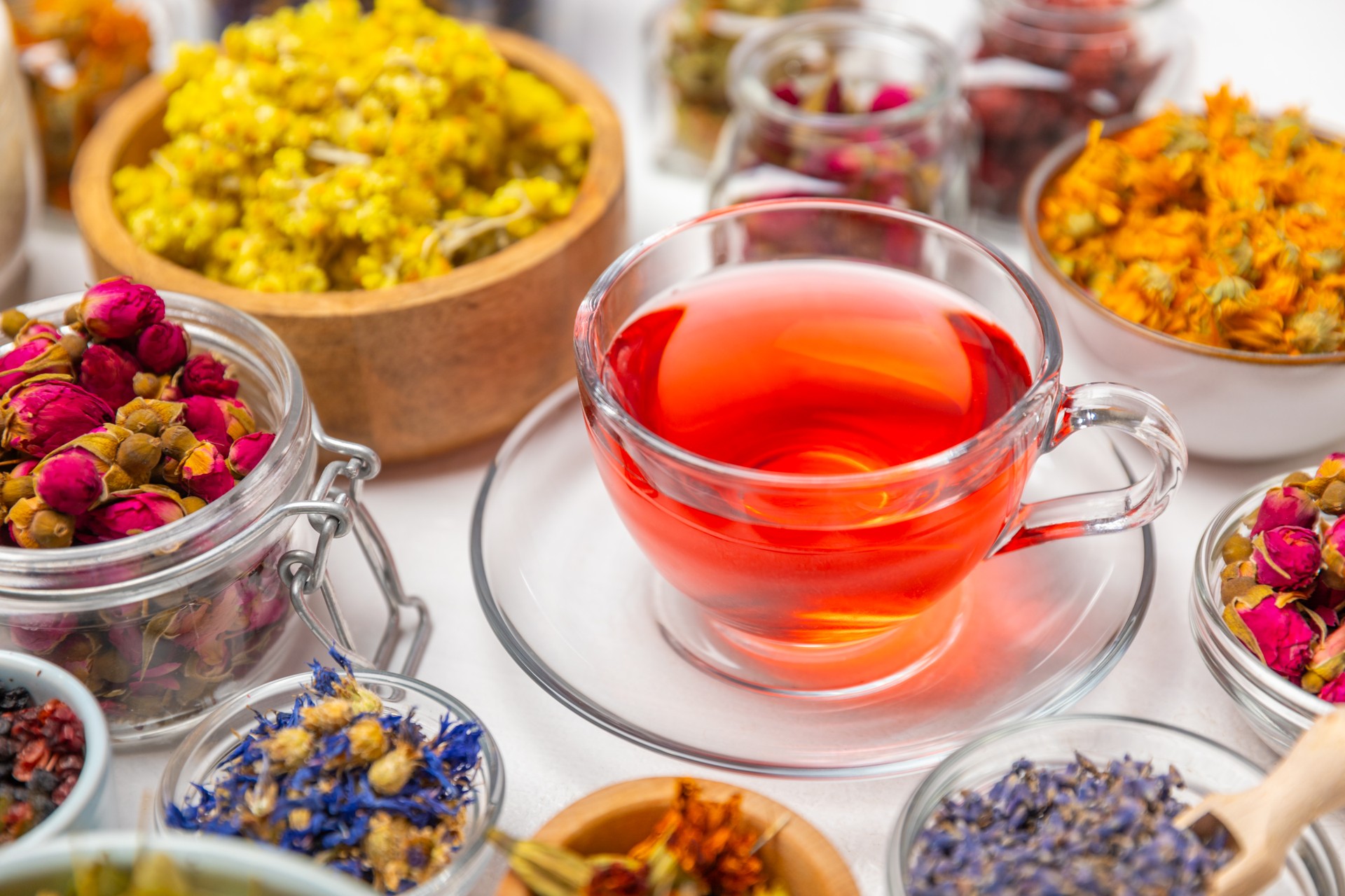 Assortment of dry herbal and berry tea on background. Tea party concept. medicinal herbs. Healing herbs.Alternative medicine.Linden, calendula, cornflowers, marigold, tansy, tea rose.